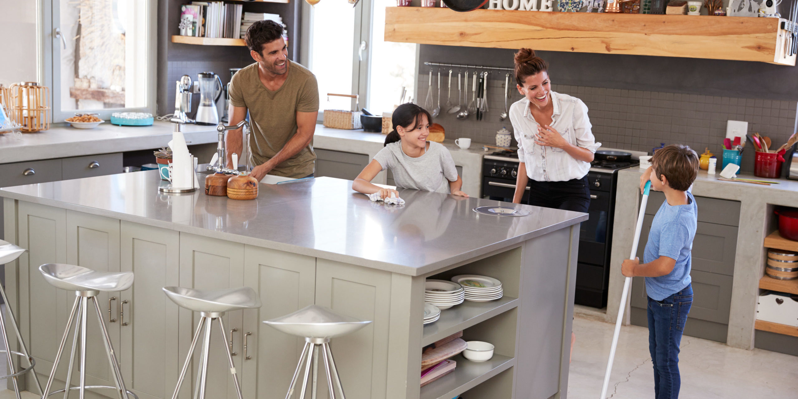 Children,Helping,Parents,With,Domestic,Chores,In,Kitchen